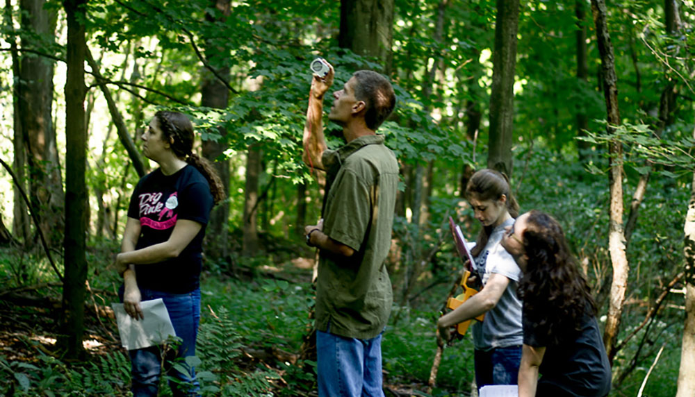 Matthew Opdyke and his botany students assess forest health and carbon sequestration at Lowries Run Slopes in Pittsburgh. | Photo by Vania Arthur
